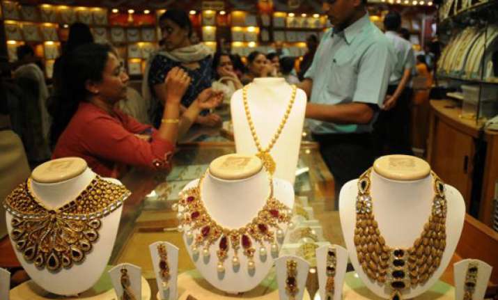 gold slips from record high on fall in demand