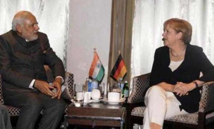 modi merkel seek to give economic muscle to indo german ties