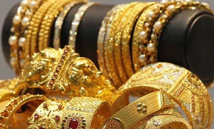 gold declines on weak global cues low demand