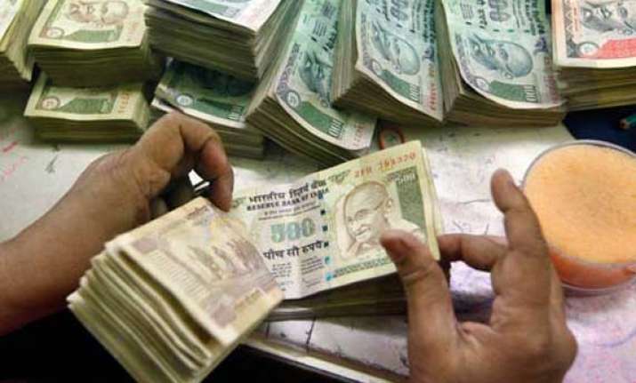 rupee up by 14 paise against dollar in early trade