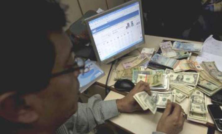 rupee up marginally closes at 49.19/20 against dollar