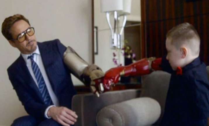 7 yr old jumps with joy as real iron man robert downey jr.