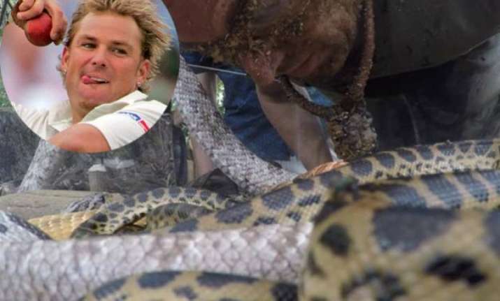 watch shane warne bitten by anaconda in south african jungle