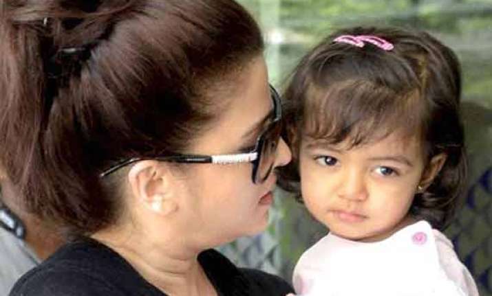 aaradhya introduced to writing on saraswati puja