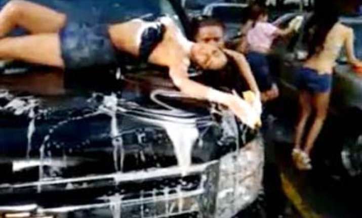 mallika washes car in love barack barely dressed