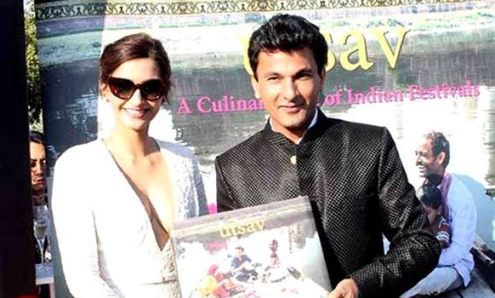 sonam kapoor unveils vikas khanna s book at cannes