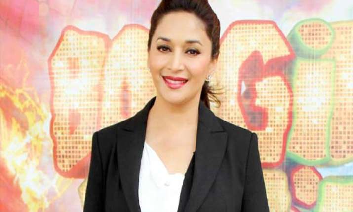 madhuri praises shah rukh salman for their devotion to work