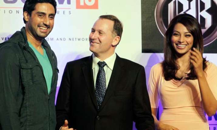 nz pm visits bollywood sets meets abhishek bipasha