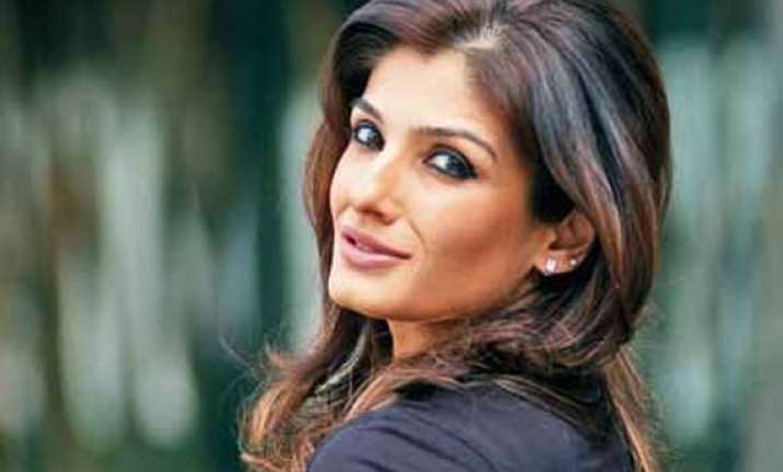 raveena tandon counters delhi heat with her red attire