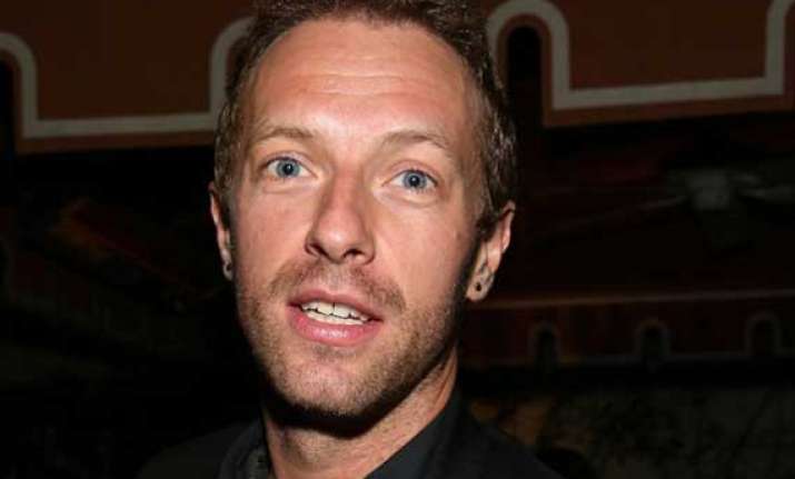 chris martin finds touring expensive