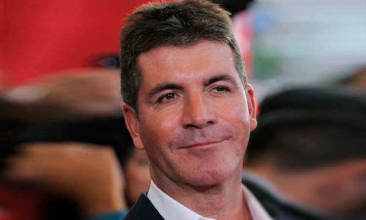 cowell talks voting by social media on x factor