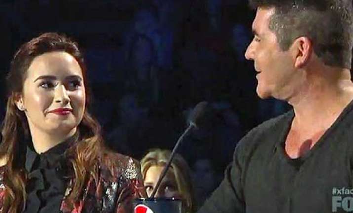 demi lovato not afraid of making simon cowell angry