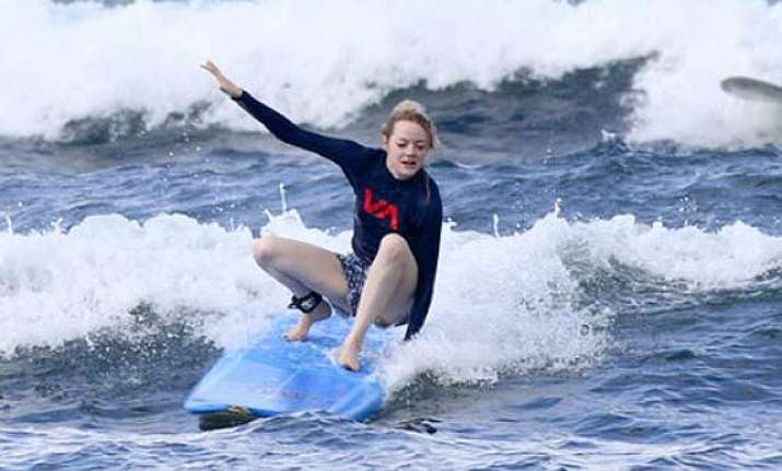 emma stone loves surfing see pics