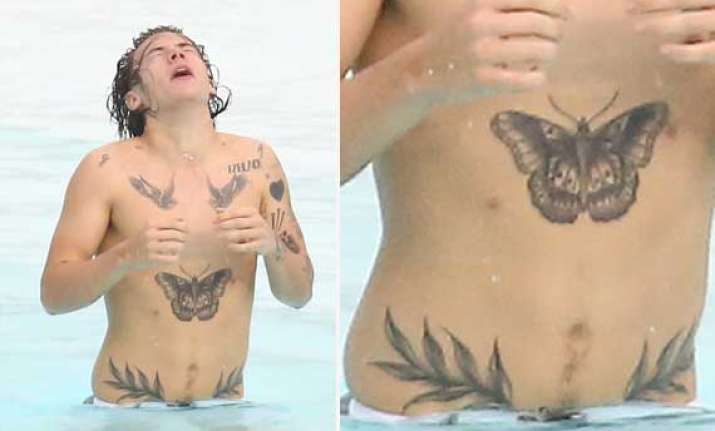 harry styles flaunts leafy tattoos