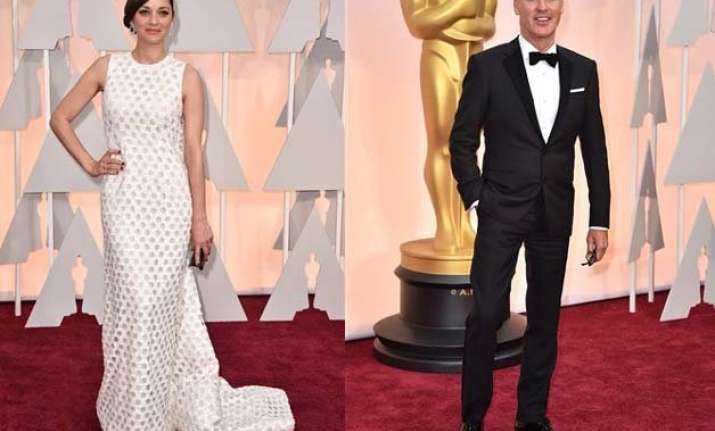 oscars 2015 stars wave to fans as they arrive at a