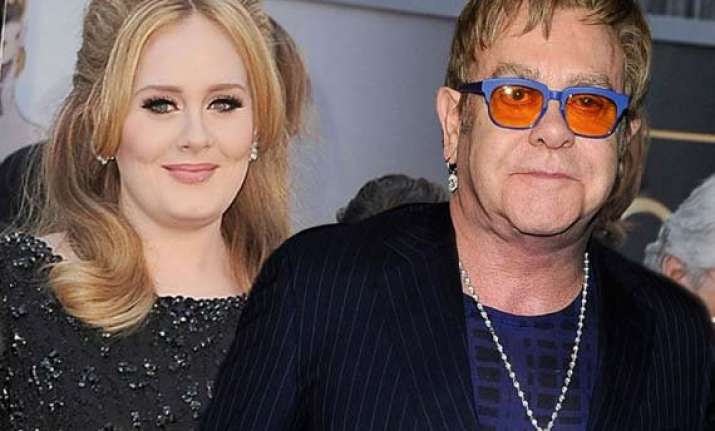 adele apologises to elton john for missing his wedding