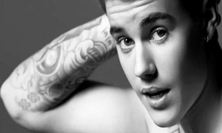 justin bieber gets cosy with model ashley moore