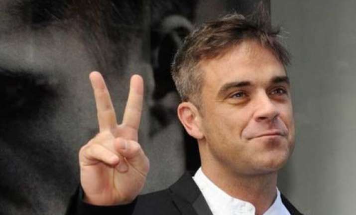robbie williams plans to quit music for a proper job