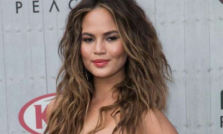 chrissy teigen poses nude for photoshoot