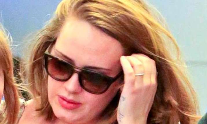 adele flashes ring post split rumours