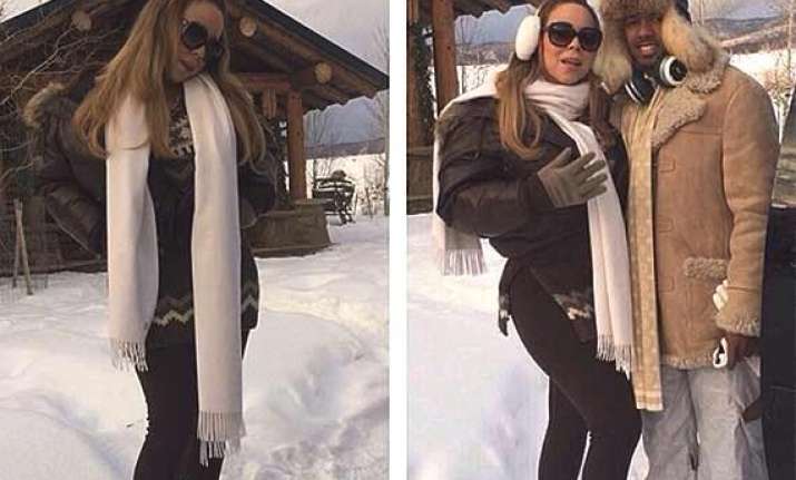 mariah carey cuddles up to cannon lookalike
