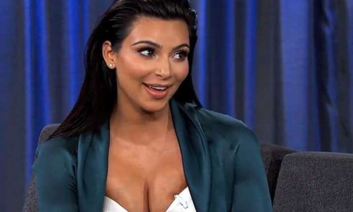 kim kardashian flaunts baby bump while exercising
