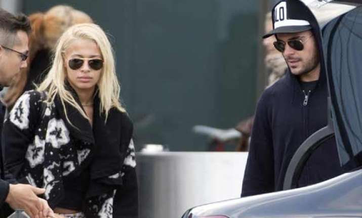 zac efron attends wedding with rumoured girlfriend