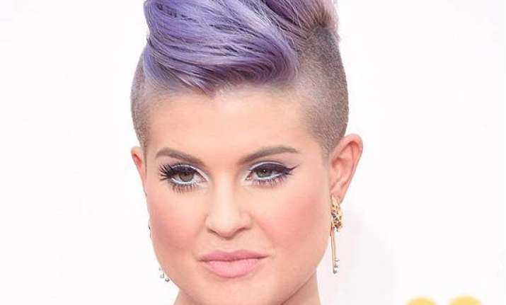 kelly osbourne to dip wisdom teeth in gold