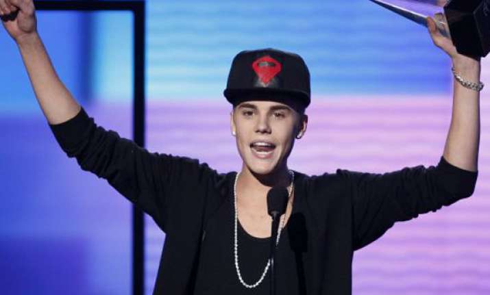 justin bieber apologised to bill clinton report
