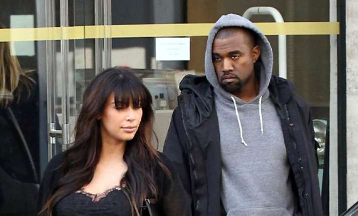 kanye west lashes out at photographer