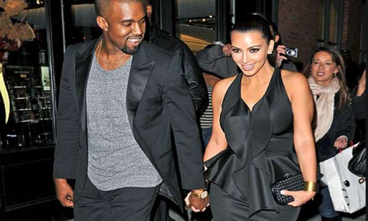kanye won t be around kim during delivery