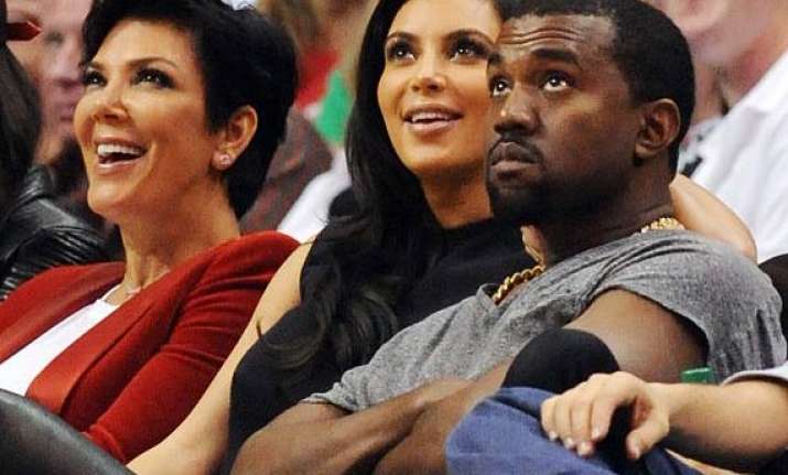 kim kanye will plan wedding on their own kris jenner
