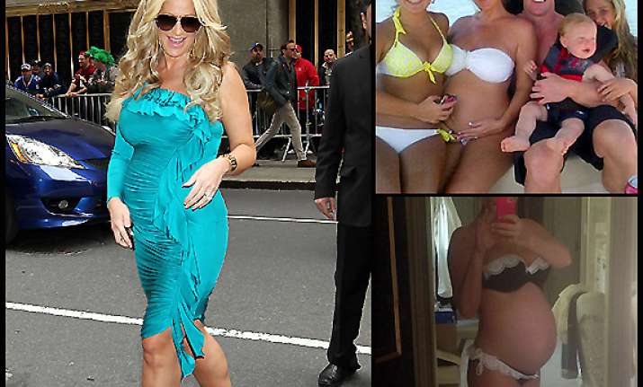 kim zolciak shows baby bump in photograph