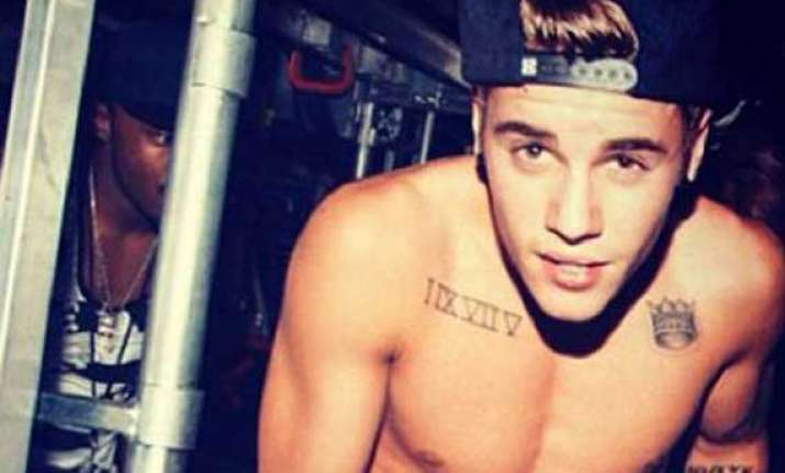 lawyers fight to keep justin bieber s semi nude photos