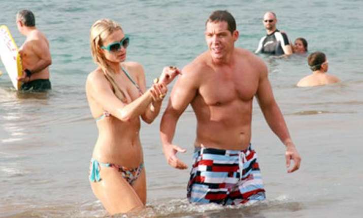 paris hilton cy waits can t keep their hands off each other