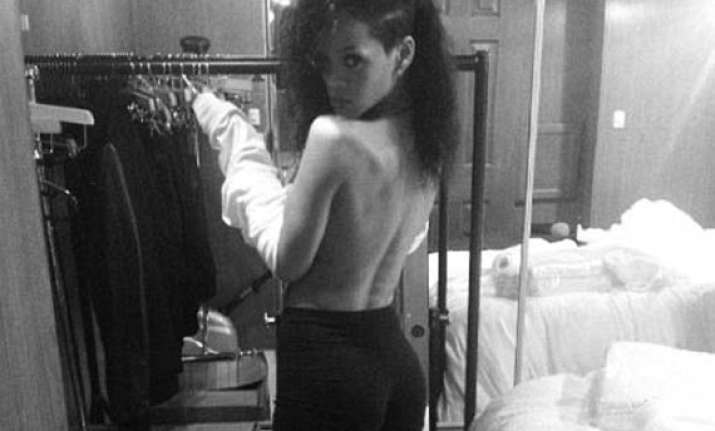 rihanna shares topless photo online