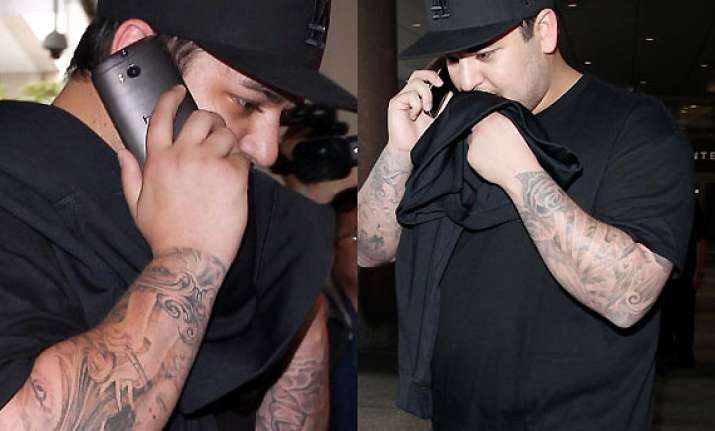 rob kardashian compelled to leave before kim kanye wedding