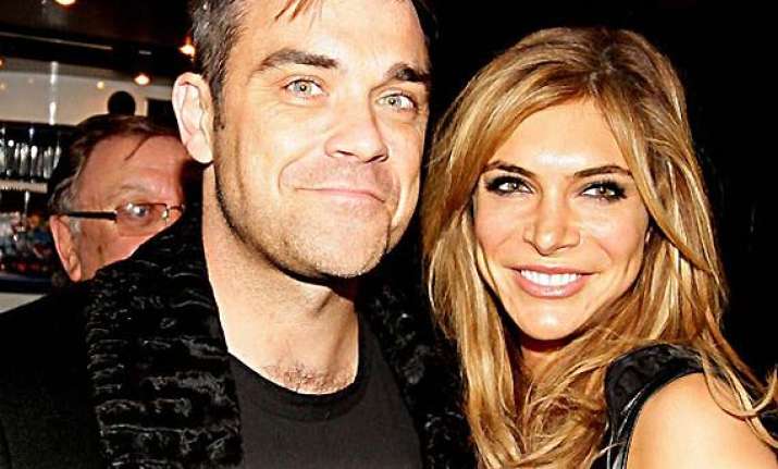 robbie williams to move back to us for wife