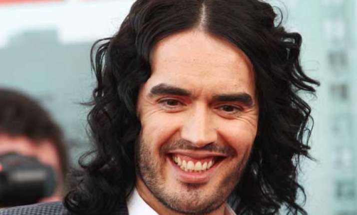russell brand turns yoga teacher