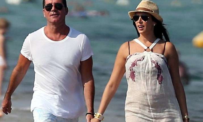 simon cowell wants to teach his son driving and music
