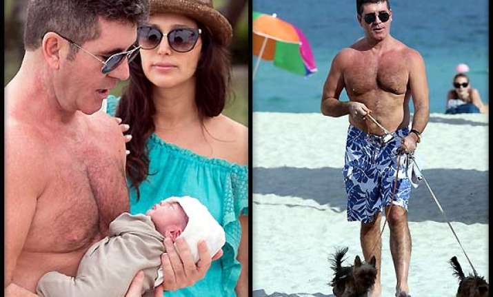 simon cowell warned for taking pet pooches on beach see pics