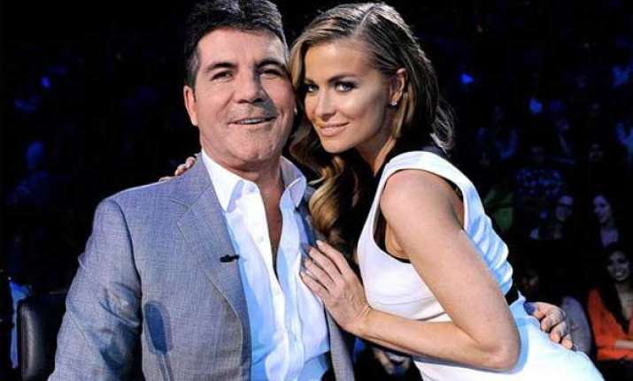 simon cowell finds carmen electra adorable