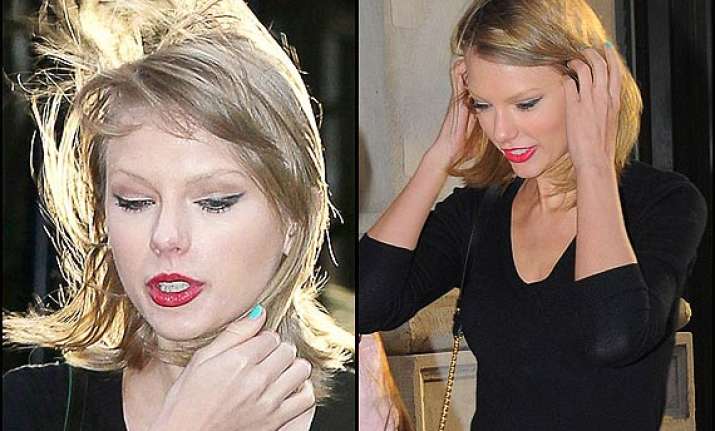 taylor swift s hair gets messed up by sudden gust see pics