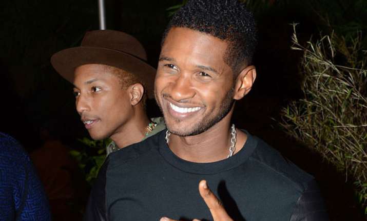 usher quits the voice for his kids