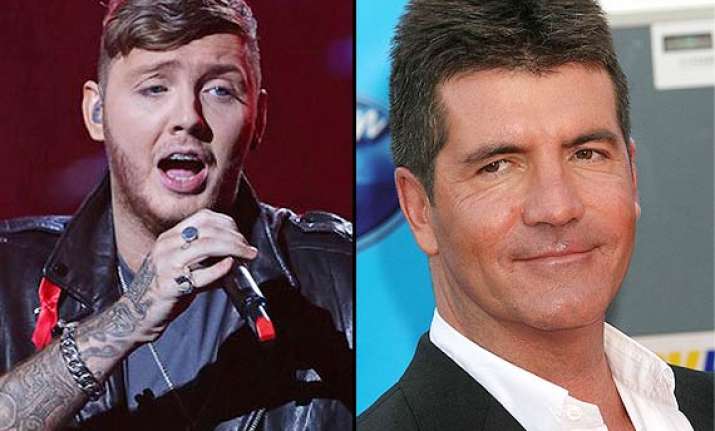 cowell fires james arther for lyrics glorifying terrorism