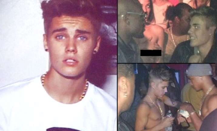 shirtless justin bieber parties with topless stripper see