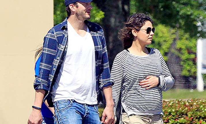 ashton kutcher doting on pregnant fiancee