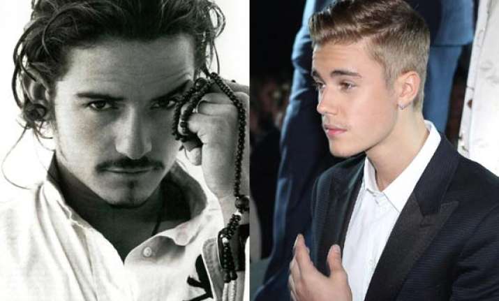 orlando bloom throws punch at justin bieber