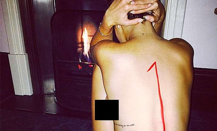 rita ora strips to celebrate song s success