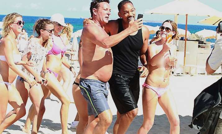 actor will smith mobbed by topless fans in ibiza
